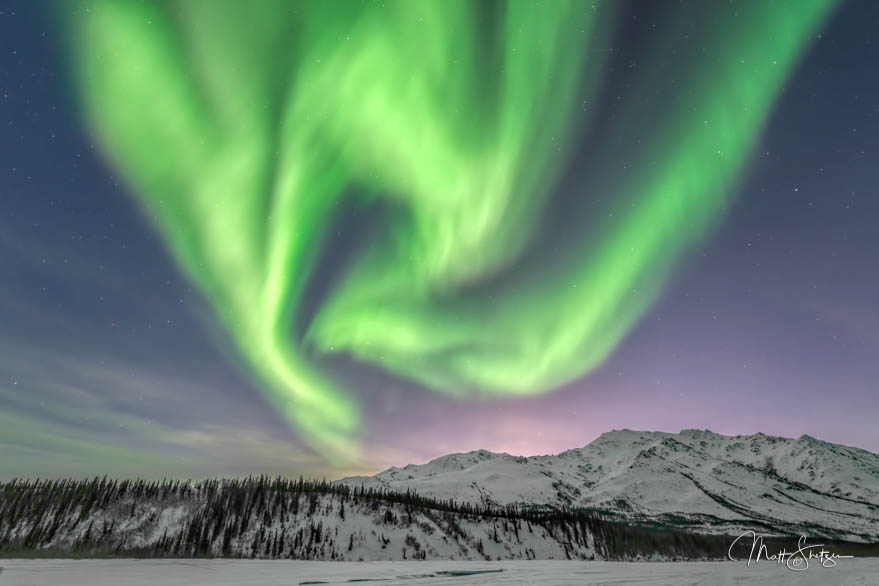 Northern Lights Pattern Forms Over Mountain Peaks