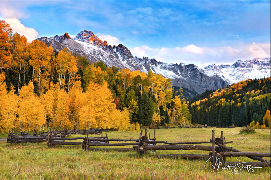 Sunrise over Mt. Sneffels and a crossbuck fence, just outside of Ridgway, Colorado