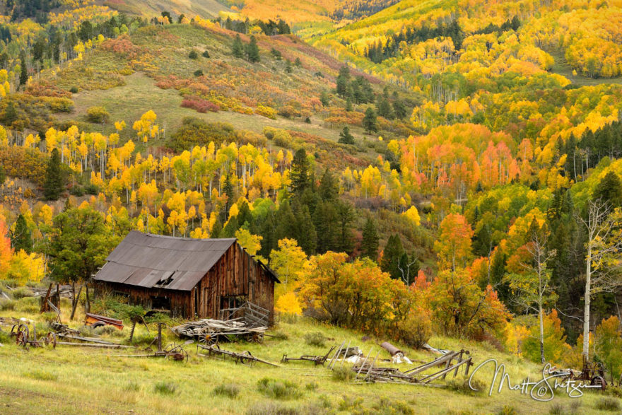 An old barn surrounded by the fall colors of Colorado backcountry