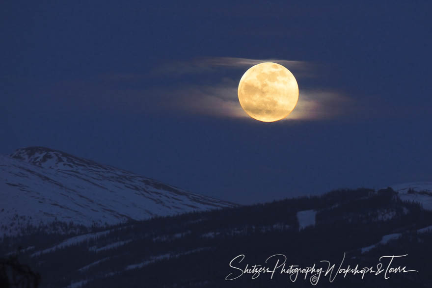 Full moon shines brightly over snowy mountain peaks 20130524 203417