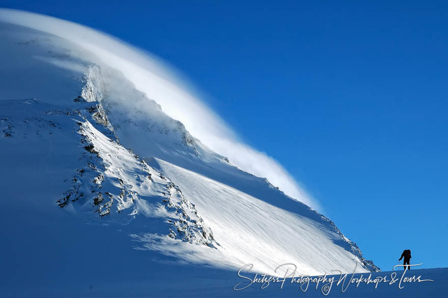 Lone Skier with Mountains