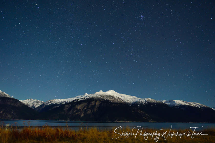 Scenic photo of stars and mountainside