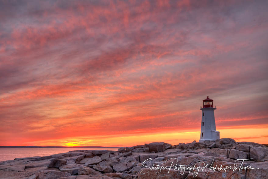 Sunset behind Peggy’s Point Lighthouse in Nova Scotia