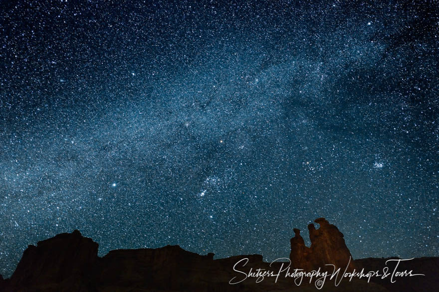 Three Gossips at night with the Milky Way