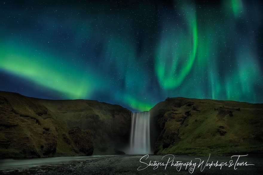 Northern Lights Above Skogafoss Waterfall in Iceland