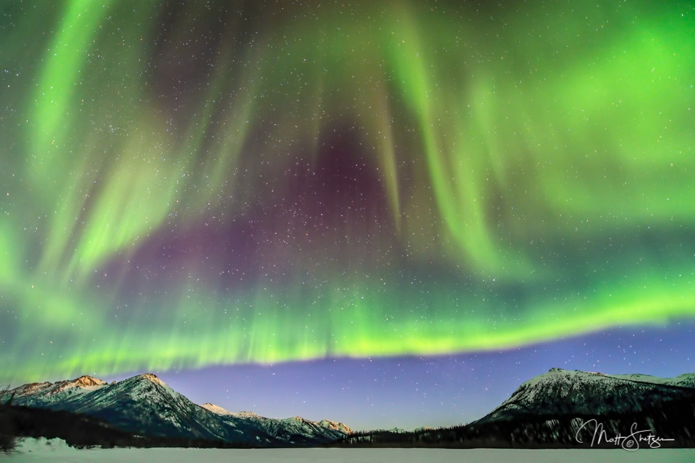 A Aurora Borealis forms curtain pattern over Wiseman Alaska