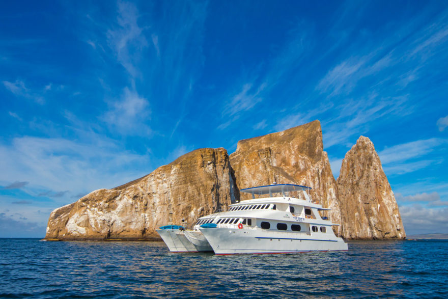 The chartered yacht next to Kicker Rock